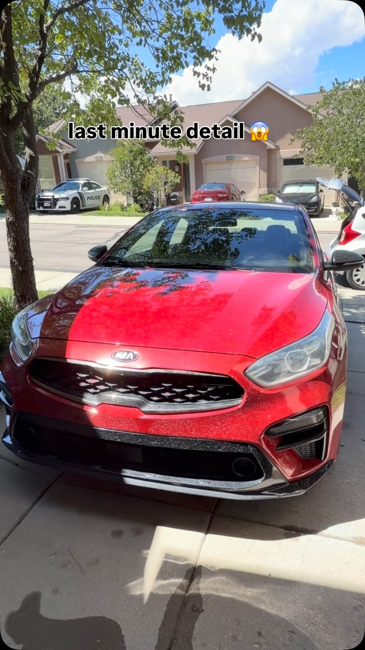 The same red Kia before its Jordan Valley Detail driveway detail