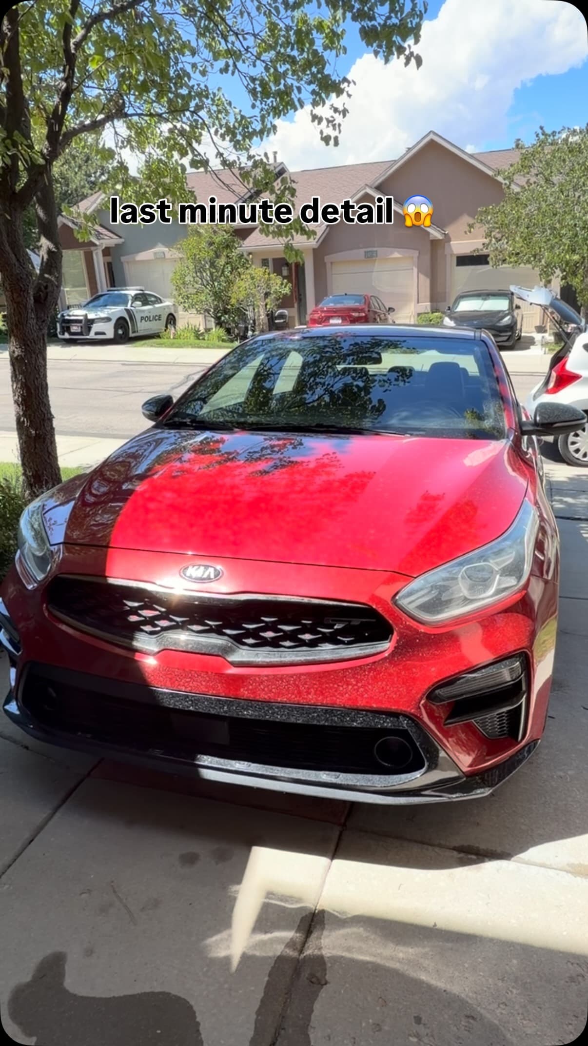 Red Kia before its Jordan Valley Detail driveway detail