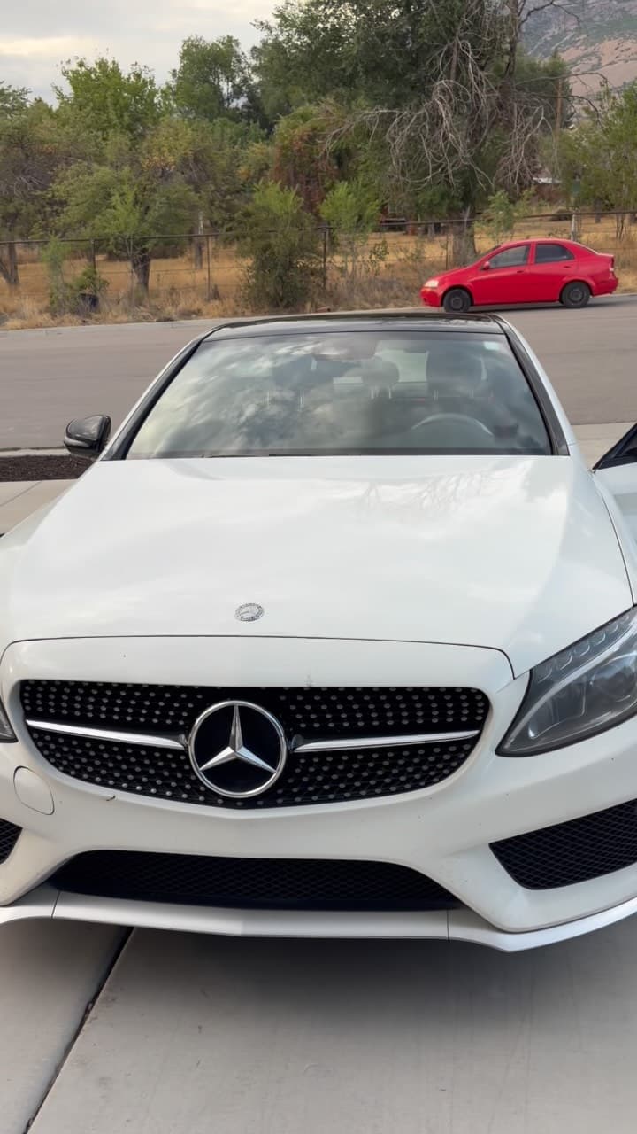 White Mercedes at a Utah driveway after a paid Jordan Valley Detail customer appointment