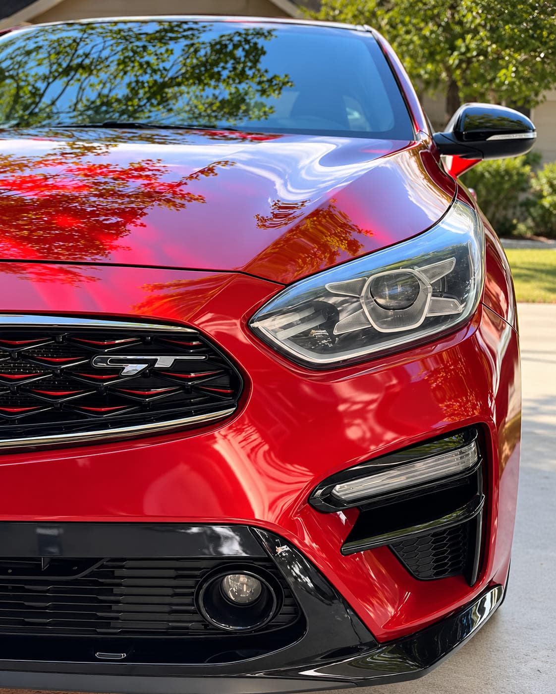 Red Kia exterior after a Jordan Valley Detail driveway Full Detail